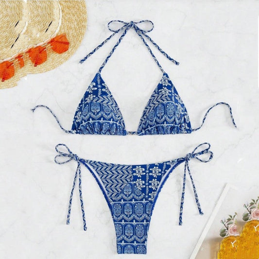 Split bikini with blue patterned stitching and bandage design.