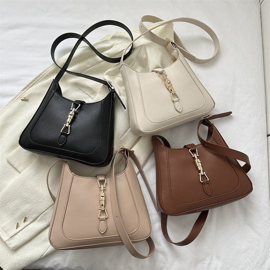 Women's summer design simple crossbody shoulder bag in black, white, khaki, and brown colors displayed on a light fabric background.