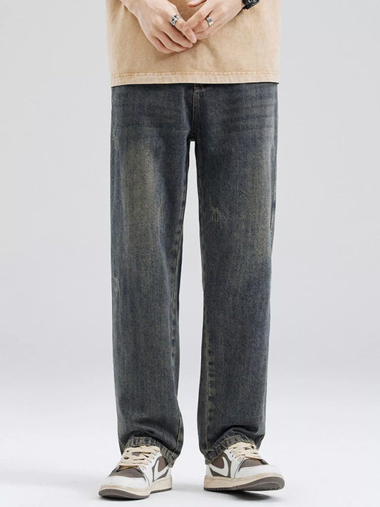 Men's full size washed relaxed fit jeans in dark denim with slight stretch and pocketed design