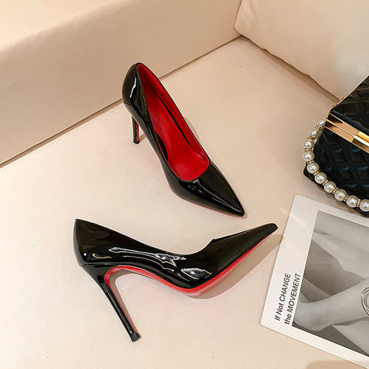 Black women's stiletto pumps with red background, high heel design, solid color pattern, suitable for daily wear.
