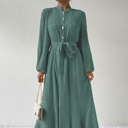 Women's fashion graceful self-tie dress in green with high waist and long sleeves.