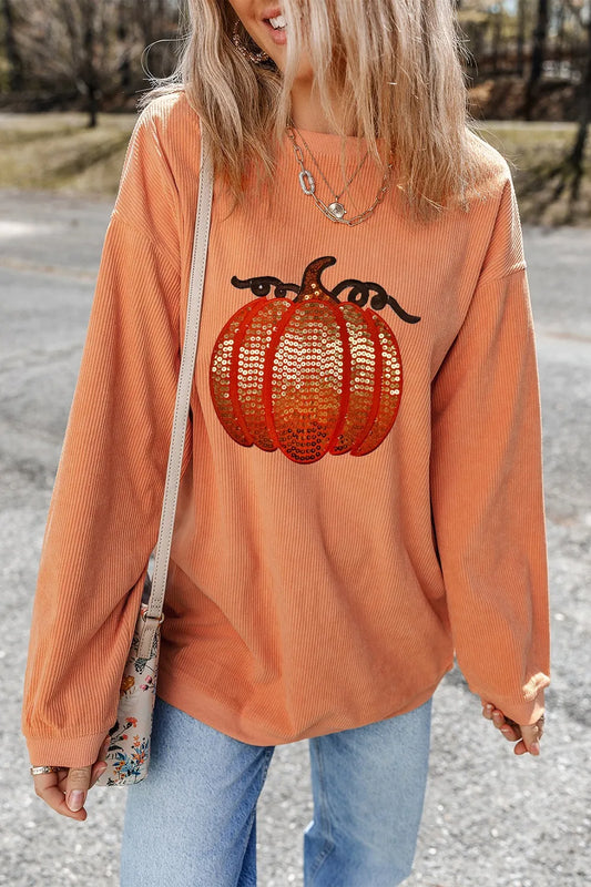Orange long sleeve sweatshirt with sequin pumpkin design and round neck