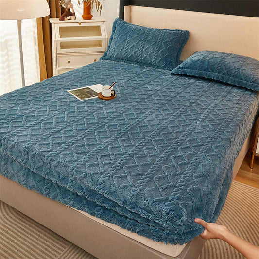 Winter thermal flannel coral fleece fitted sheet on bed with pillows, showcasing fleece-lined non-slip material.