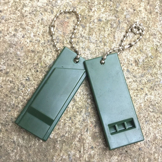 Outdoor emergency treble frequency conversion whistle for survival use, green ABS material with chain.