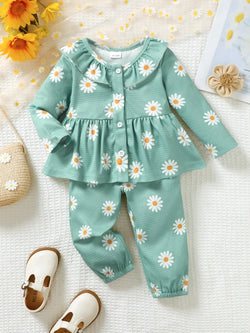 Children's peplum blouse and pants set with ruffled collar and daisy print in green polyester blend fabric
