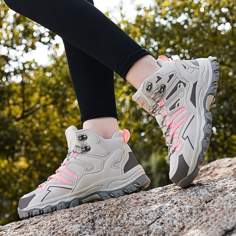Hiking Same High-top Outdoor Shoes in light brown, featuring low-top design and lace-up front, worn on rocky terrain.