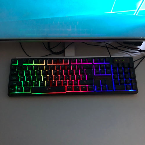 Black light keyboard with RGB backlit keys, slim and ergonomic design for smooth and quiet typing.