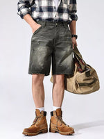 Men's loose fit distressed cotton shorts with pockets, styled with plaid shirt and boots