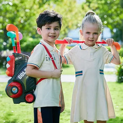 Children playing with a colorful trolley box golf toy club set outdoors.