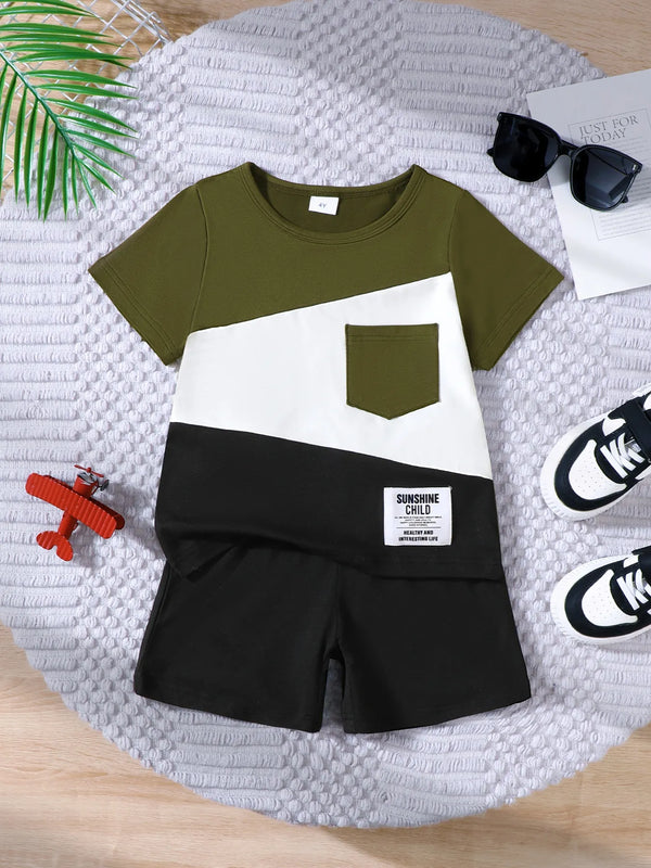 Children's color block short sleeve top and shorts set in olive, white, and black with pocket and label detail