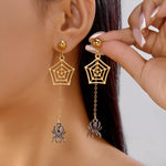 18K gold-plated spider drop earrings with web design and hanging spider charm on model