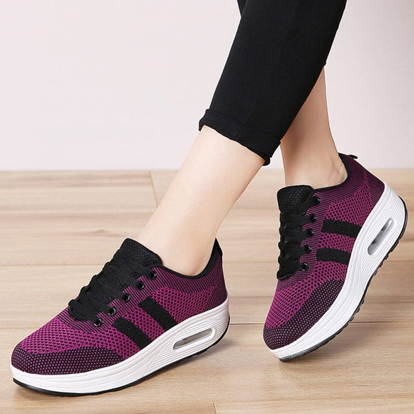 Women's fashion platform air cushion casual shoes in purple and black, featuring solid color pattern and flyknit material.