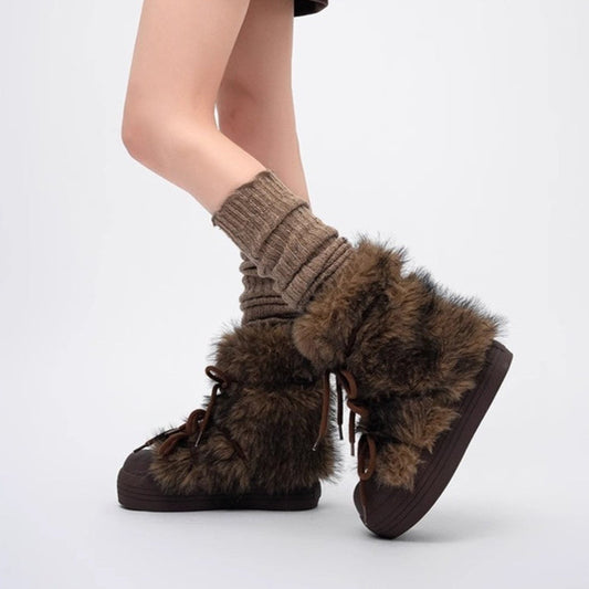 Thick bottom fur snow boots with suede leather and flat rubber heel.