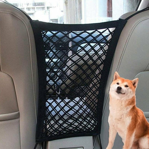 Black premium pet car net installed between front seats with dog nearby
