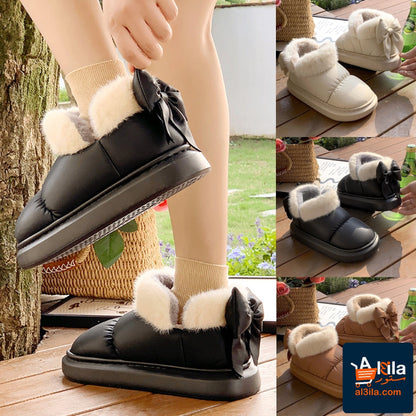 Winter women cute warm ankle boots with non-slip thick sole, furry bow, and PU waterproof design.